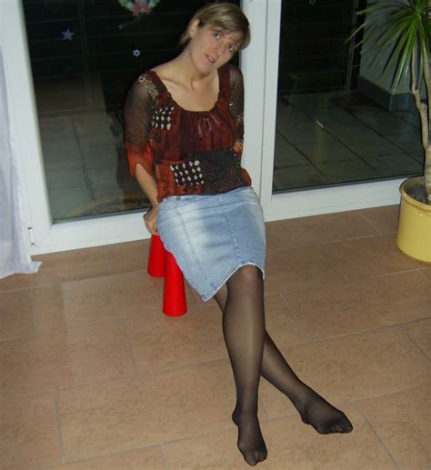 candid legs on twitter denim skirt with black pantyhose and sexy crossed legs and nylon feet