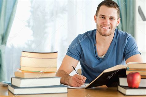 Smiling Student Preparing For Test — Stock Photo © Wavebreakmedia 11201870