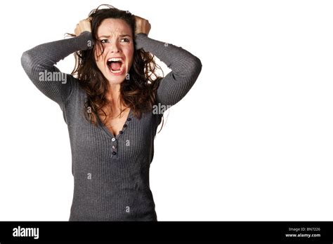 A Frustrated And Angry Woman Is Screaming Out Loud And Pulling Her Hair