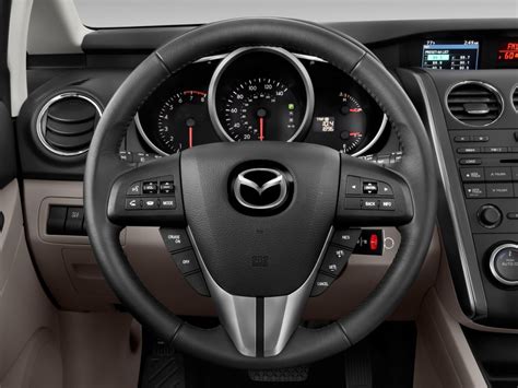 I dismissed it as another crossover that promised to combine all the worst light duty attributes of a car with the. Image: 2010 Mazda CX-7 FWD 4-door i Sport Steering Wheel ...