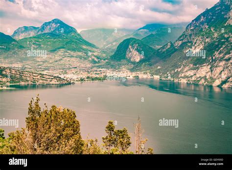 Panorama Of The Gorgeous Lake Garda Surrounded By Mountains In Torbole