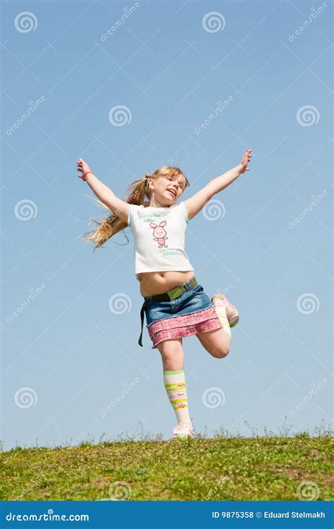 Little Girl Jumping Against Beautiful Sky Stock Photo Image Of