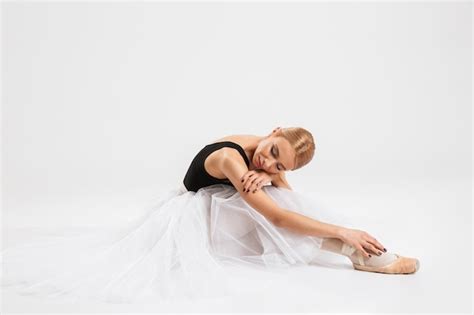 Premium Photo Beautiful Young Woman Ballerina Sitting On Floor