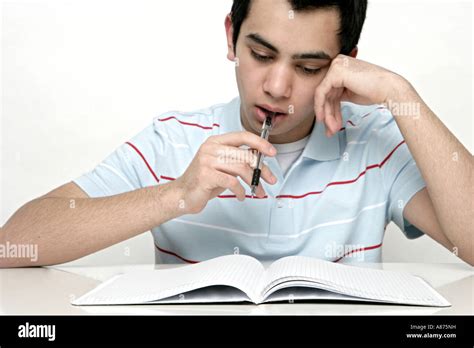 View Of A Teenage Boy Studying Stock Photo Alamy