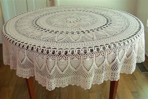 There are actually two ways to fold round or oval tablecloths. Decor: Lovely Lace Tablecloths For Dining Table Decoration ...