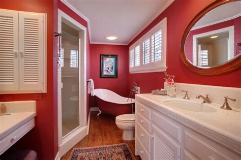 A bright red bathroom fully clad with tiles including the bathtub is a bold idea for a kid a bright red bathroom fully clad with tiles including the shower space and vanity, with white appliances and white towels a bright red bathroom with white marble tiles, a white sink, mosaic tiles on the floor and potted plants to refresh the space 39 Cool And Bold Red Bathroom Design Ideas - DigsDigs