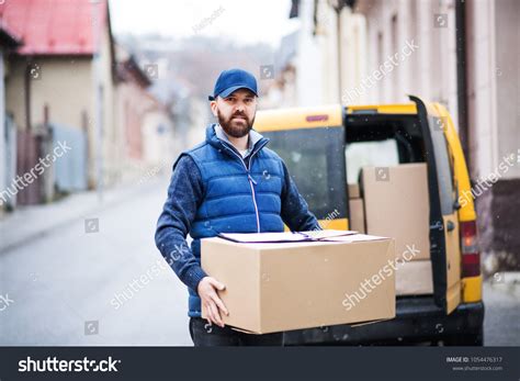 Delivery Man Delivering Parcel Box Recipient Stock Photo 1054476317