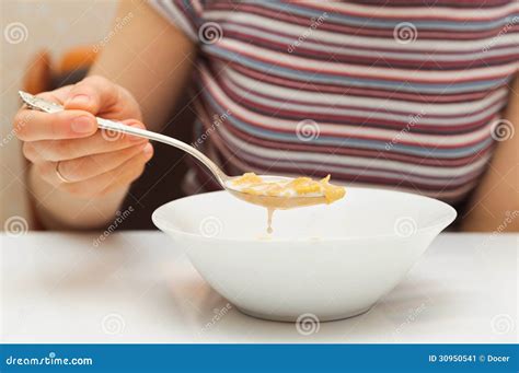 Woman Holds A Spoon And Eating Flakes With Milk Stock Image Image Of