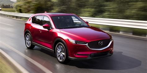 You get about 31 cubic feet behind the second row, and folding down the back seats opens up about 60 cubic feet. 2021 Mazda CX-5 Review, Pricing, and Specs