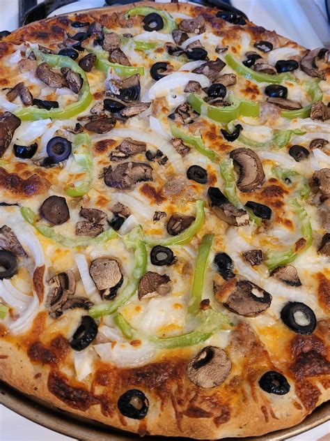 Homemade Pizzasausageoniongreen Pepper Mushrooms And Black Olive
