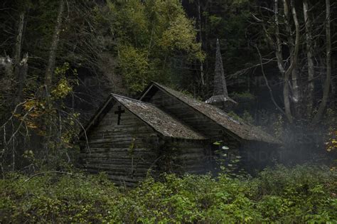 Spooky Abandoned Church In Foggy Night Scene Stock Photo