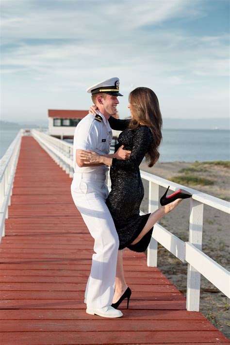 Flirty Photo Of Cute Couple On A Red Boardwalk At Crissy Field In San Francisco Military Couples