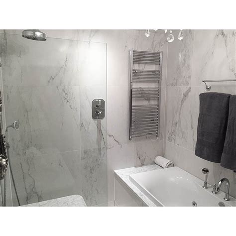 Designing a space that you can truly relax in is all about creating a serene interior, without anything to distract you. Buy Calacatta Porcelain Marble Tile