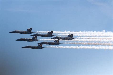 Six Us Navy Blue Angel Jets Flying In Formation Leaving A Vapor Trail
