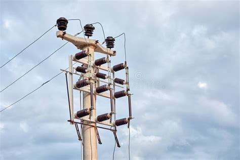 Minimalist View Of A Concrete High Voltage Power Electric Pole Power