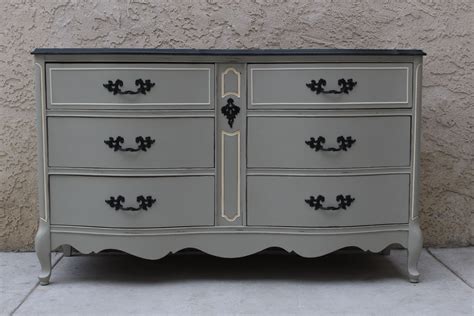 Wisteria and aidan gray sell french provincial furniture with stunning paint finishes, new linen upholstery, and it really goes to show how these vintage sets can look stunning with a little bit of improvement, modern upholstery and a coat of paint. French Provincial dresser painted in Grey with Graphite ...