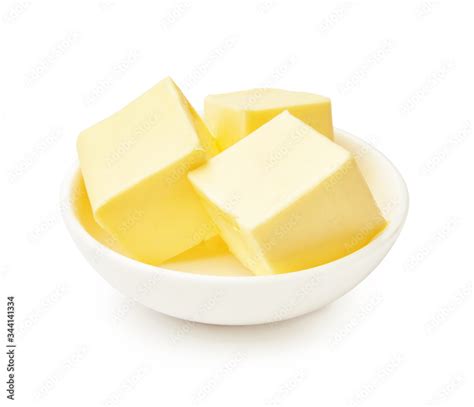 Butter Pieces In White Bowl Isolated On White Background Butter Cubes