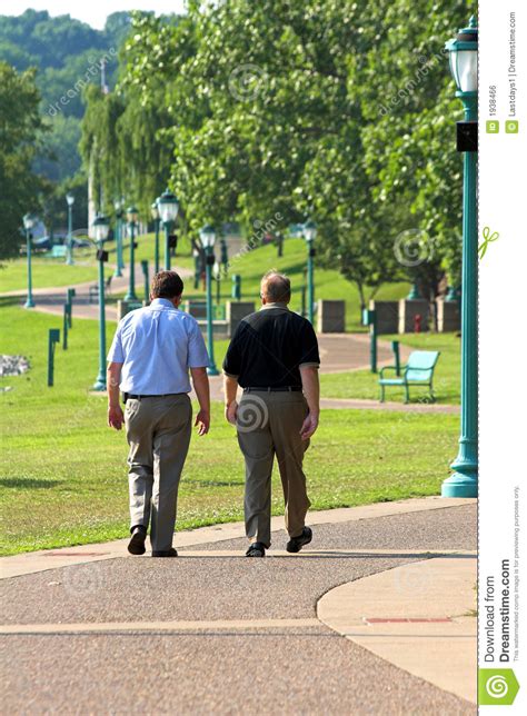 Two Men Walking Stock Photo Image Of Blue Busy Body 1938466