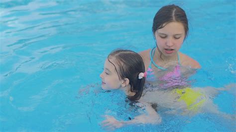 Girl Teaches Younger Sister To Swim Stock Footage Sbv 320193291 Storyblocks