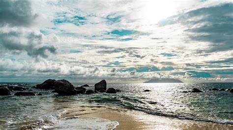 Stones Rocks On Ocean Waves Under Blue White Clouds Sky Hd Nature