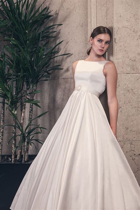 So not your average beach wedding dress! Our simple yet regal Thea wedding ball gown. #elegant # ...