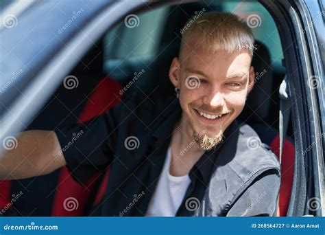 Young Caucasian Man Smiling Confident Driving Car At Street Stock Image