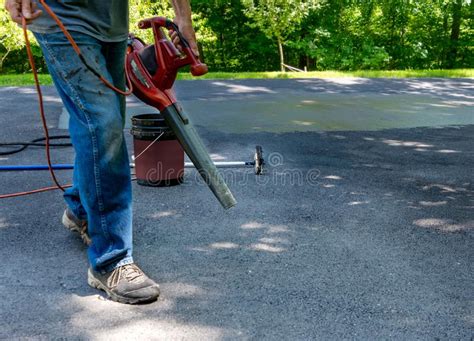But, of course, as with any diy project, the devil is in the details. Home Maintenance. Do It Yourself Driveway Resealing. Stock Photo - Image of blacktopping ...