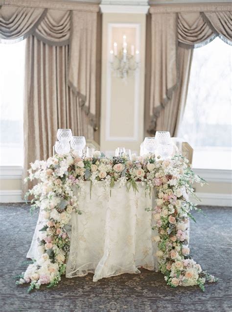 Sweetheart Table With Muted Floral Garland Photography Lauren Fair