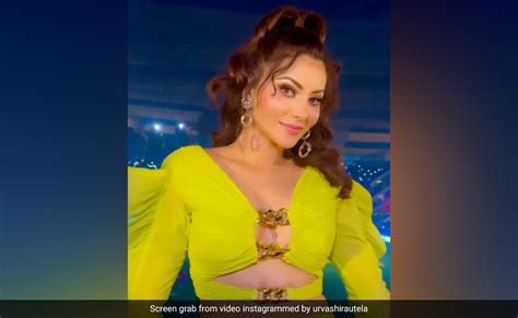 urvashi rautela posing for paparazzi at airport gate as girl caught laughing at her on camera