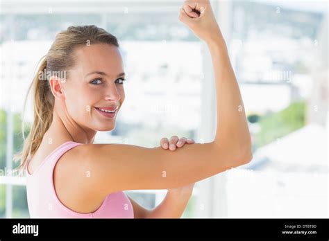 Young Woman Flexing Muscles In Gym Stock Photo Alamy