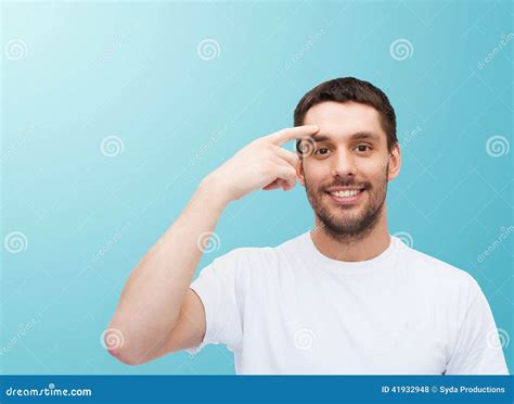 Smiling Young Handsome Man Pointing To Forehead Stock Photo Image Of