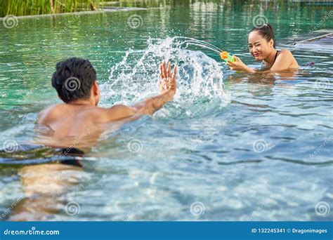 Playful Couple In Swimming Pool Stock Image Image Of Swimming