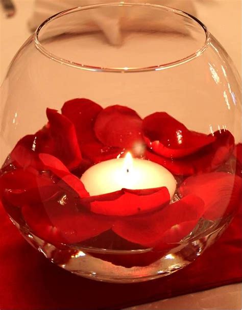 Beautiful and simple table décor. Rose petals and a ...
