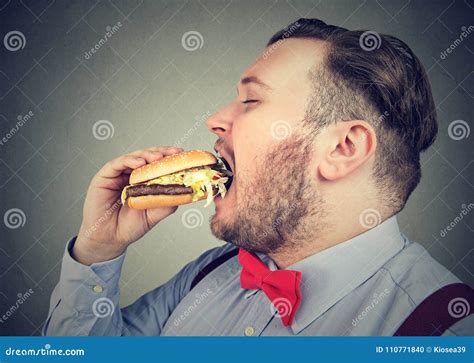 Fat Man Eating A Hamburger Stock Photo Image Of Hamburger