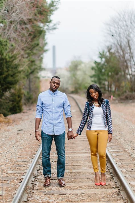Trendy And Stylish African American Couple Holding Hands While Walking