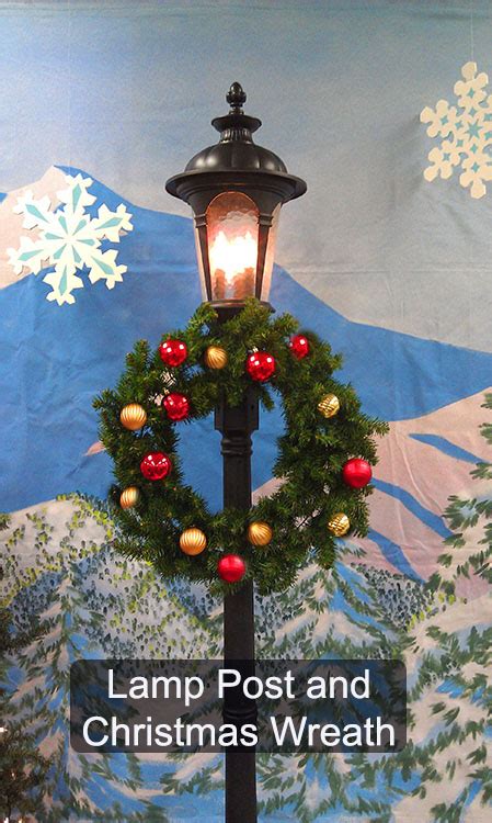 The holiday lamp post is decorated with white berries, pinecones, a christmas fabric bow and features a decorative base. Christmas