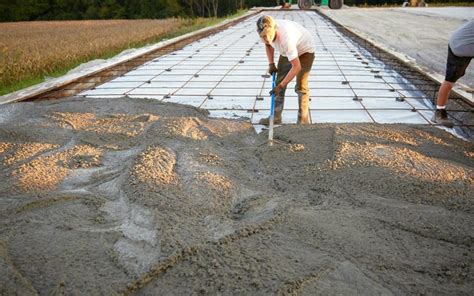 Pour concrete against the forms and spread it out evenly across the project area. Pouring a Concrete Driveway or Walkway