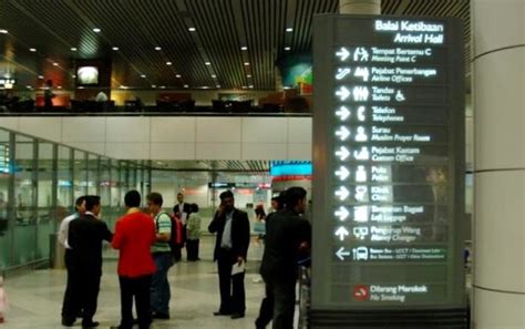 For issues concerning lost property (tel: 19: Directional sign, KLIA main terminal, arrival hall ...