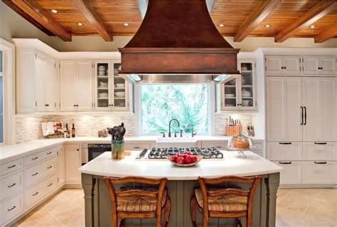 A kitchen can get extremely hot while cooking. The main types of kitchen hoods. Photo gallery and description