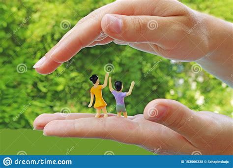 Protect Children, Symbolic Picture With Miniature Figurines Stock Photo 