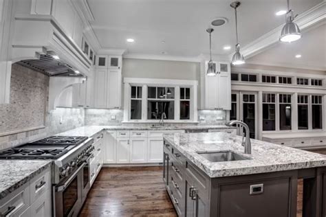 The blue and green backsplash enhances the room's. Luna pearl granite countertops - give your kitchen a ...