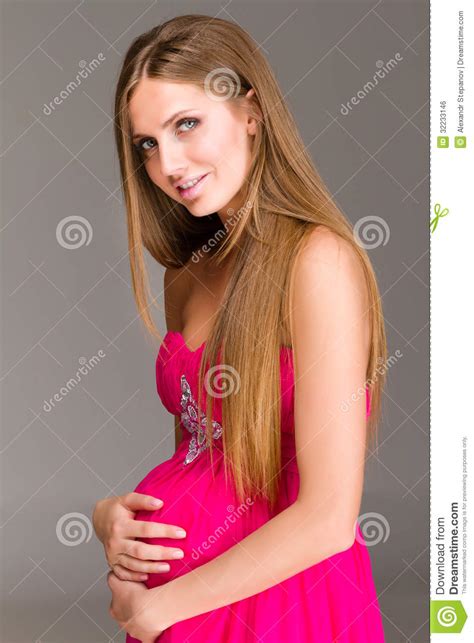 Smiling Pregnant Woman On Gray Background Royalty Free Stock Image