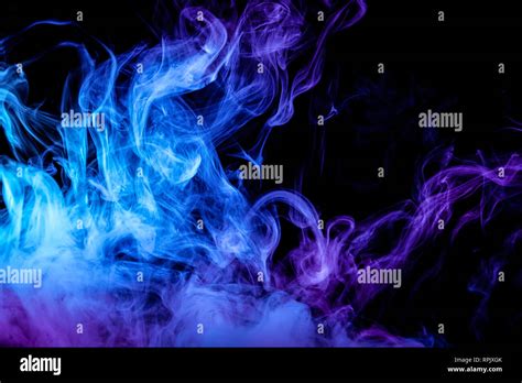 Abstract Art Colored Purple And Blue Smoke On Black Isolated Background