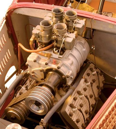 A supercharged flathead ford v8 with a cragar roots style blower, custom billet aluminum intake and pulleys, demon carburetors. Supercharger and carbs atop Ford flathead V-8 | Vintage ...