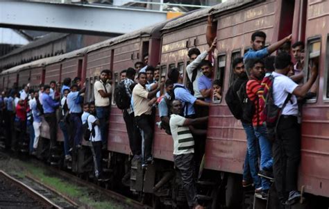 Passengers Cling On To Side Of Carriages During Sri Lanka Train Strike