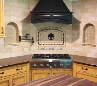 Mosaic tile come in sheets with a mesh backing to make it easy to install. Fleur de Lis backsplash mosaic stone and metal medallion ...