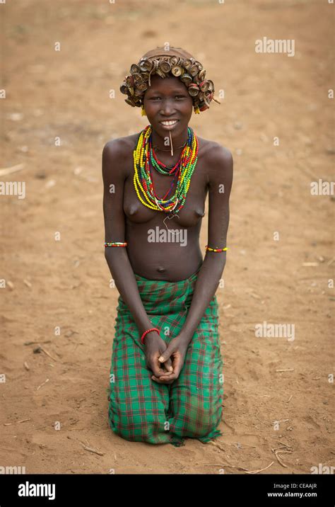 Young Smiling Dassanech Woman Wearing Bottle Caps Headdress Omo Valley