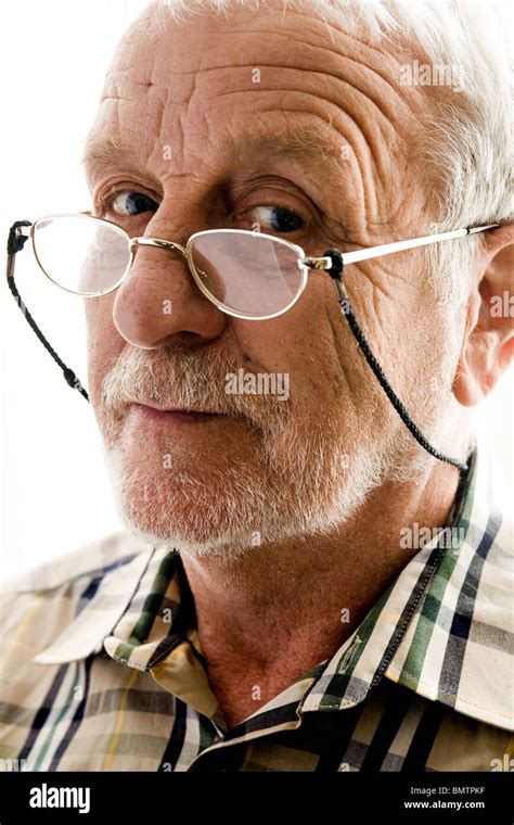 Portrait Of An Elderly Man With Reading Glasses Stock Photo Alamy