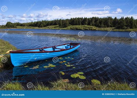 Blue Boat In A Lake Stock Photo Image Of Outdoors River 33883962