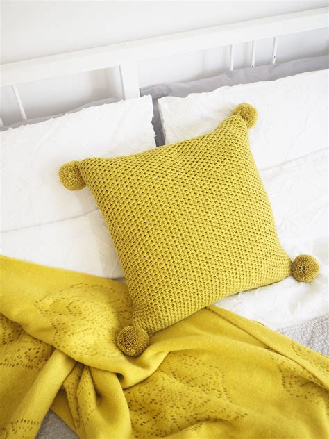jazz up any cushion at home with my simple 10 minute pom pom cushion diy tutorial try it